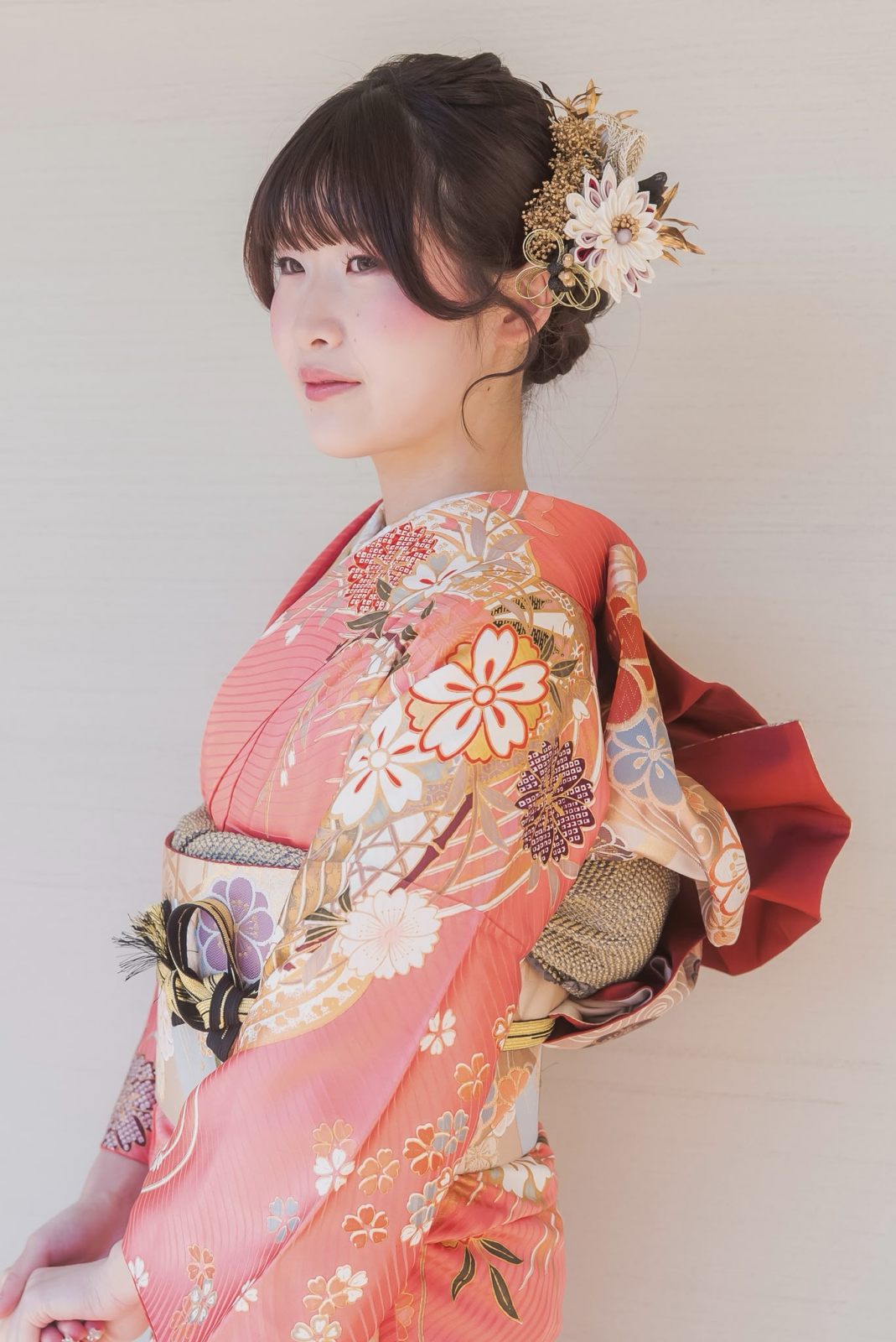 Kimono updo with gold kanzashi and a pink furisode