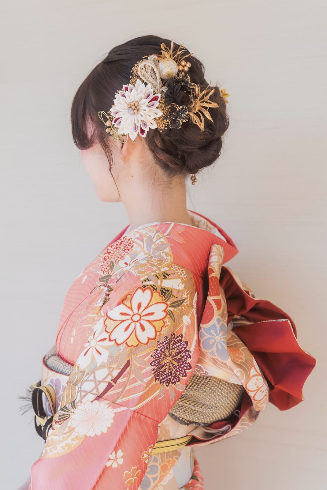 Kimono updo with gold ornaments, side profile